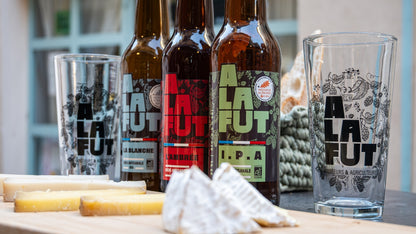 Craft beer and cheese tasting in Nice with local brewery bottles and artisan French cheeses on a tasting table in the French Riviera.