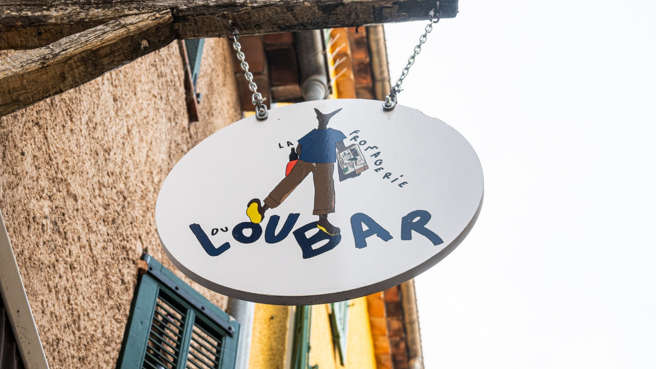 Local fromagerie in Nice Old Town hosting a cheese and beer tasting experience with artisan French cheeses and guided explanations.