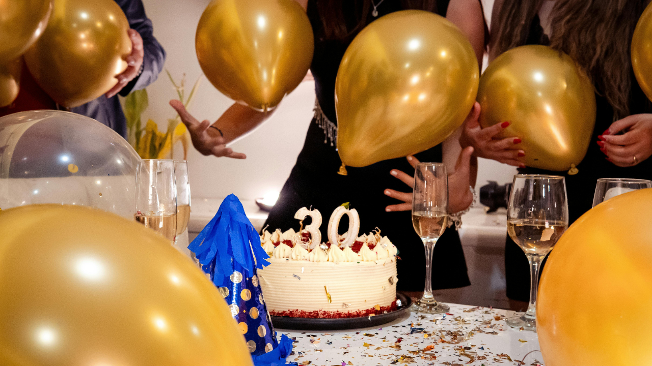 Private birthday celebration in Nice with champagne and gold balloons