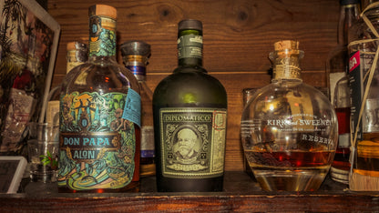 Premium rum tasting in Nice with aged Caribbean rum bottles displayed in a local bar during a guided spirits experience on the French Riviera.