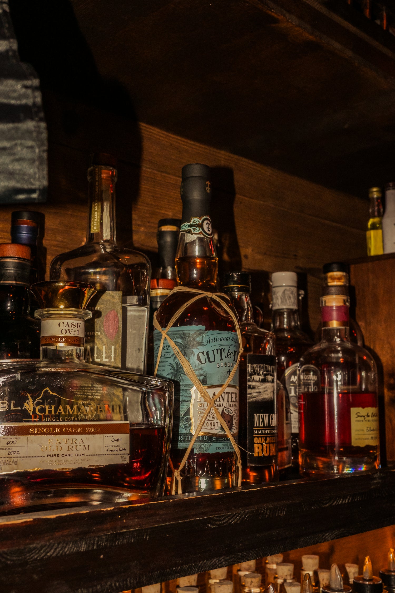 Premium rum tasting in Nice Old Town with selection of aged rum bottles displayed in a local bar on the French Riviera.