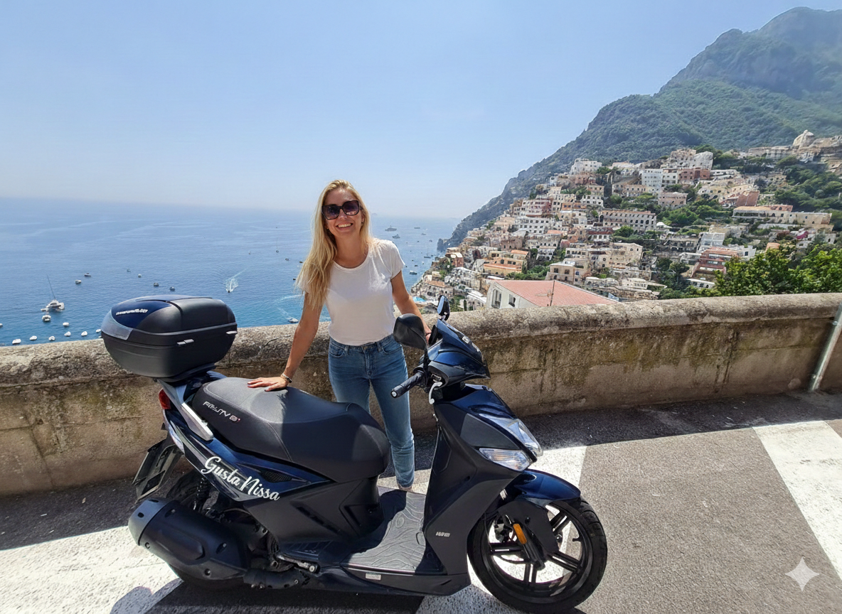 Woman on a scooter overlooking the French Riviera coastline during a scenic tour near Nice