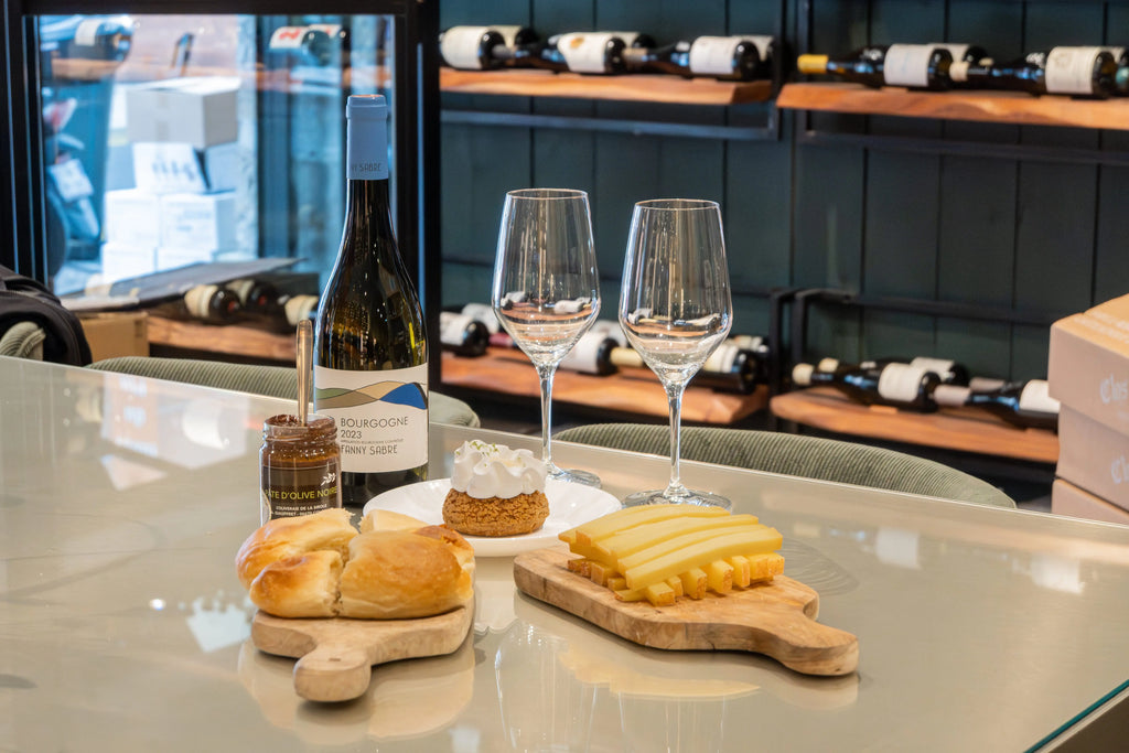 Wine and cheese tasting table with French gourmet products during a wine tasting experience in Nice on the French Riviera