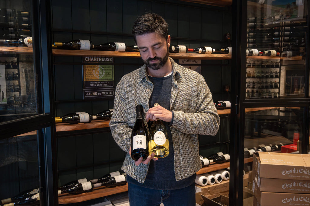 Sommelier selecting wine bottles in wine cellar Nice France wine tasting experience French Riviera local wines Provence Alpes Côte d’Azur gastronomy wine bar food tour Nice