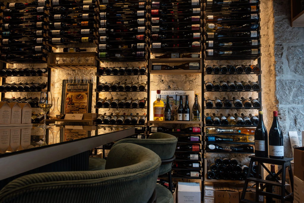 Traditional wine cellar with French wine bottles used for wine tasting experiences in Nice on the French Riviera