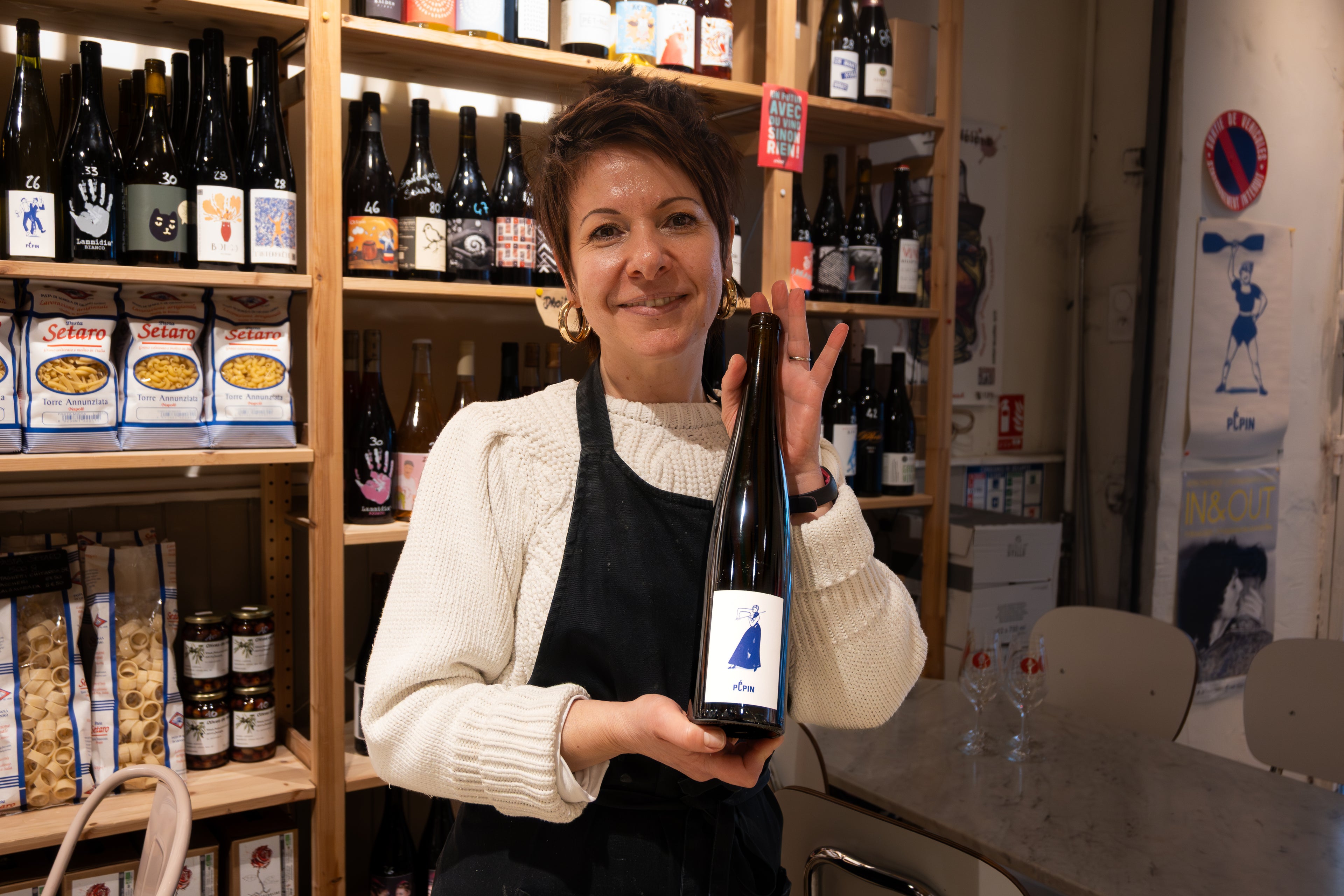 Local wine shop Nice France sommelier holding wine bottle French Riviera wine tasting experience local gastronomy Provence Alpes Côte d’Azur wine cellar food tour Nice
